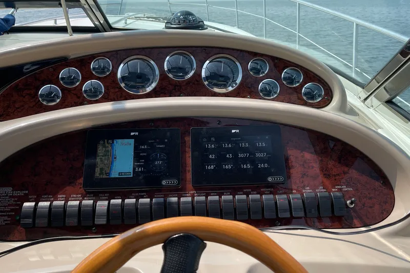 Slide: The Image of Dashboard of a 2000 Sea Ray 380 Sundancer boat with navigation instruments. - 18