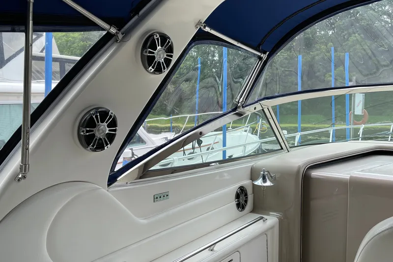 Slide: The Image of Interior view of a 2000 Sea Ray 380 Sundancer boat with speakers and windows. - 7