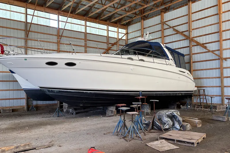 Slide: The Image of 2000 Sea Ray 380 Sundancer yacht stored in a wooden boathouse. - 39