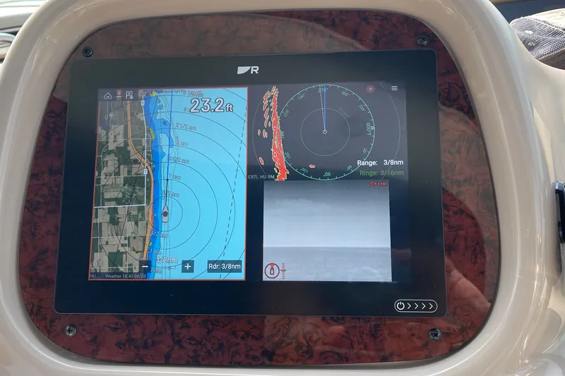 Slide: The Image of Navigation display on a 2000 Sea Ray 380 Sundancer showing map and radar data. - 16