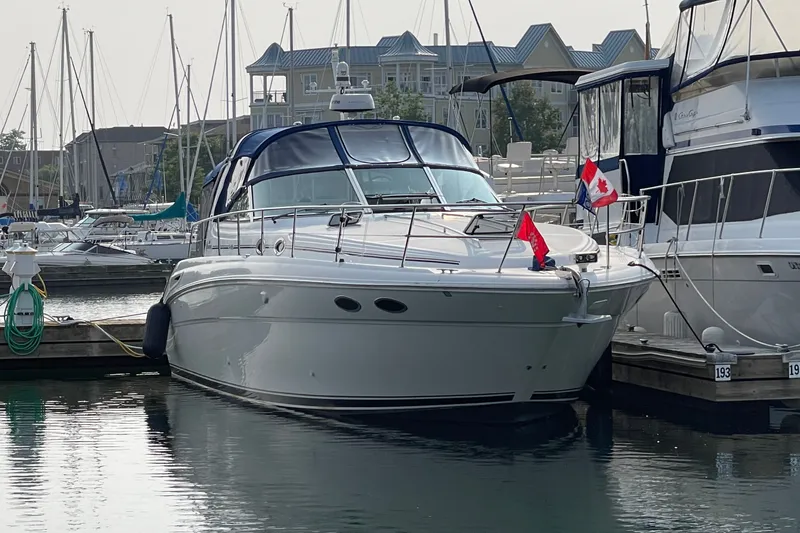 Slide: The Image of 2000 Sea Ray 380 Sundancer yacht docked at marina with Canadian flag. - 36
