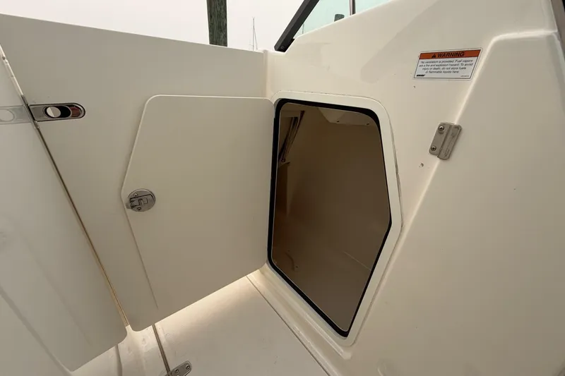 Slide: The Image of Open storage compartment on a 2022 Boston Whaler 240 Vantage boat. - 16