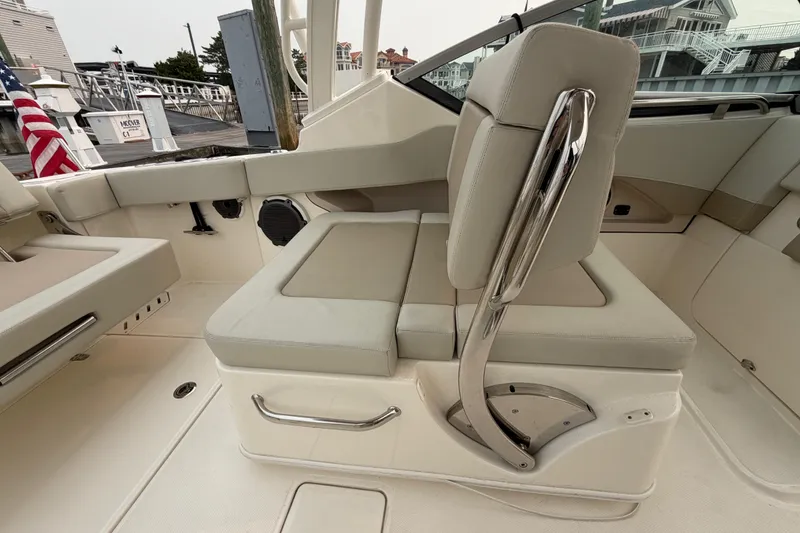 Slide: The Image of 2022 Boston Whaler 240 Vantage boat interior with cushioned seating and sleek design. - 37
