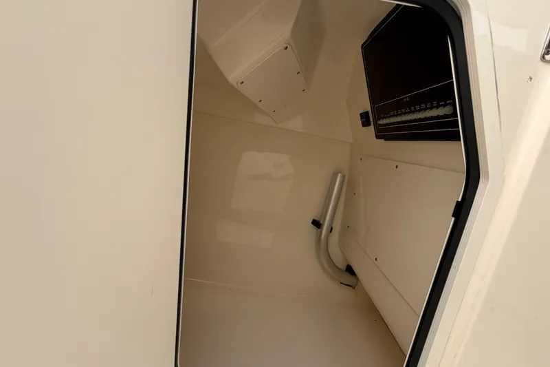 Slide: The Image of Interior view of 2022 Boston Whaler 240 Vantage boat cabin, showcasing storage space. - 17