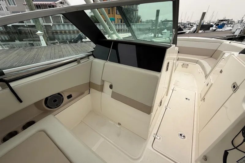 Slide: The Image of Interior view of a 2022 Boston Whaler 240 Vantage boat, showcasing seating and deck layout. - 31