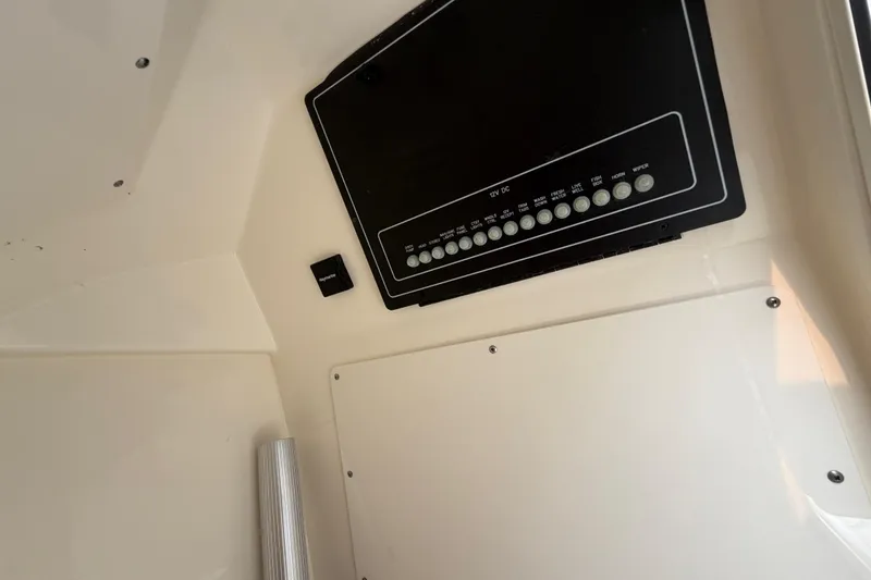 Slide: The Image of Control panel inside a 2022 Boston Whaler 240 Vantage boat. - 18