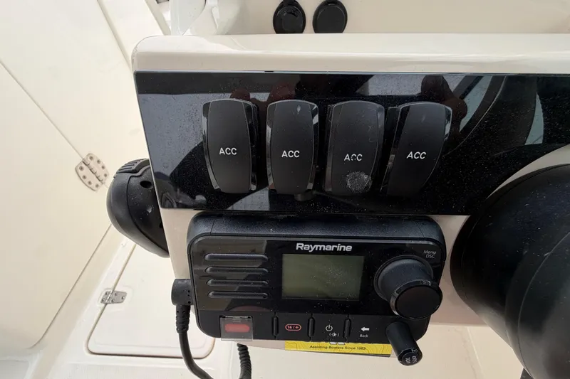 Slide: The Image of Control panel of a 2022 Boston Whaler 240 Vantage with Raymarine equipment. - 30