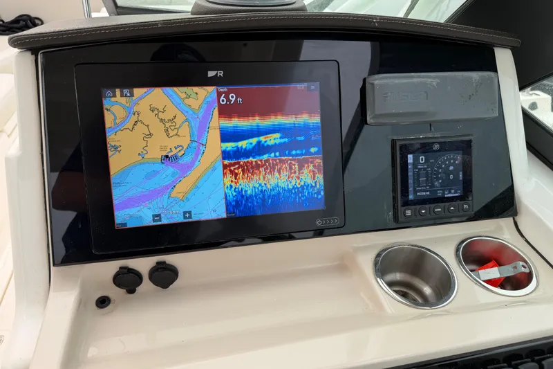 Slide: The Image of Dashboard of 2022 Boston Whaler 240 Vantage with navigation and sonar display. - 26