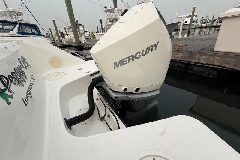 Slide: The Image of Boston Whaler 240 Vantage 2022 with Mercury outboard engine at dock. - 52