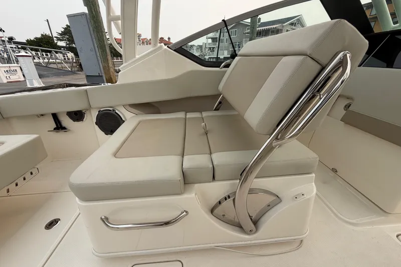 Slide: The Image of 2022 Boston Whaler 240 Vantage boat interior with adjustable seating and stainless steel accents. - 38