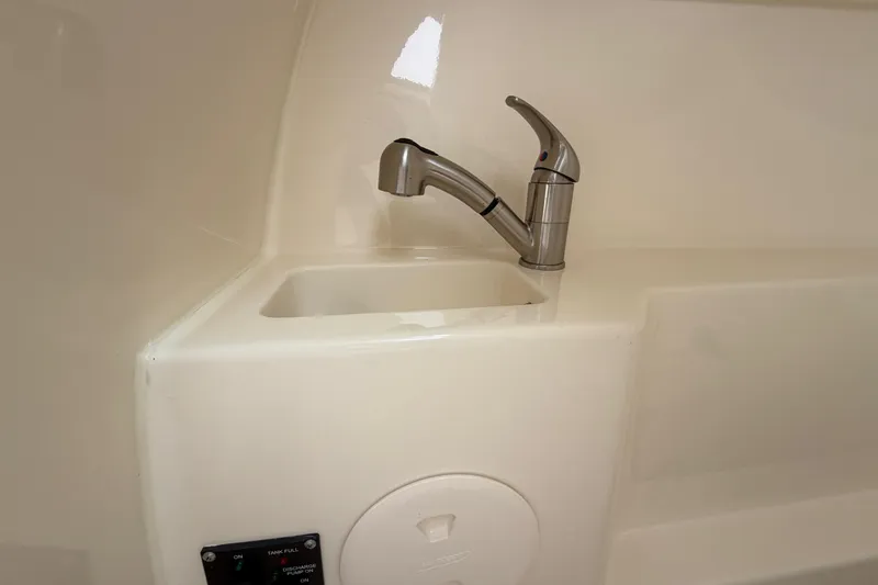Slide: The Image of 2022 Boston Whaler 240 Vantage boat sink with modern faucet design. - 34