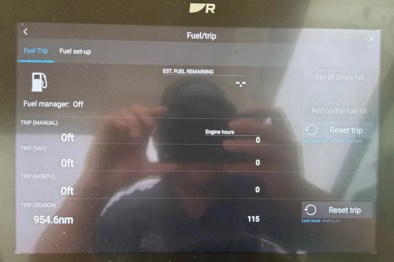Slide: The Image of Display screen of a 2022 Boston Whaler 240 Vantage showing fuel and trip data. - 27