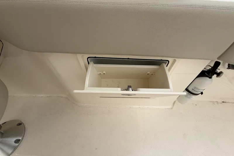 Slide: The Image of Storage compartment on a 2022 Boston Whaler 240 Vantage boat interior. - 50