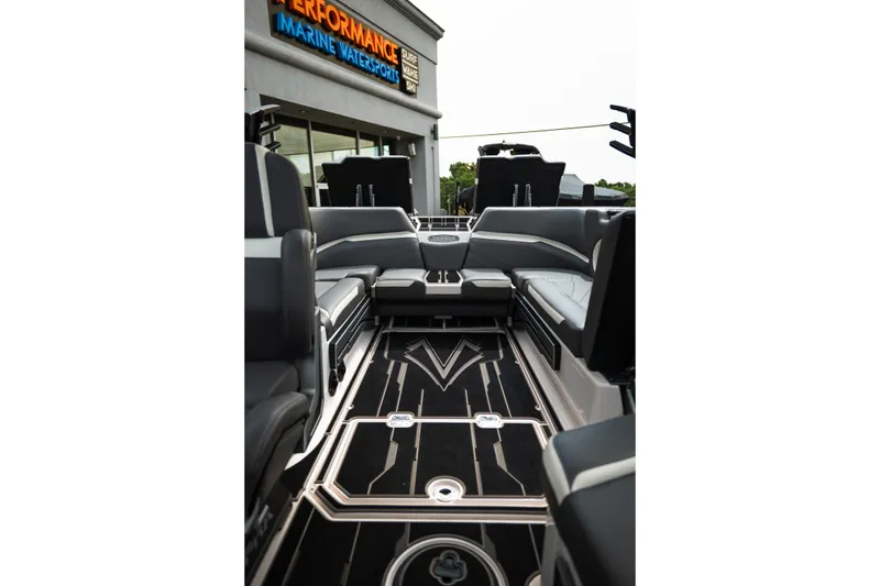 Slide: The Image of 2023 Supra SL 450 boat interior with sleek seating and modern design. - 19
