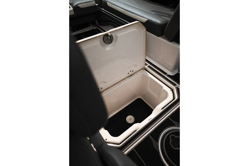 Slide: The Image of 2023 Supra SL 450 interior storage compartment with open lid, showcasing spacious design. - 24