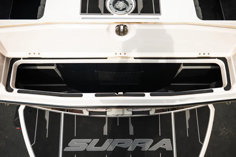 Slide: The Image of 2023 Supra SL 450 boat storage compartment with open hatch, showcasing spacious interior design. - 40