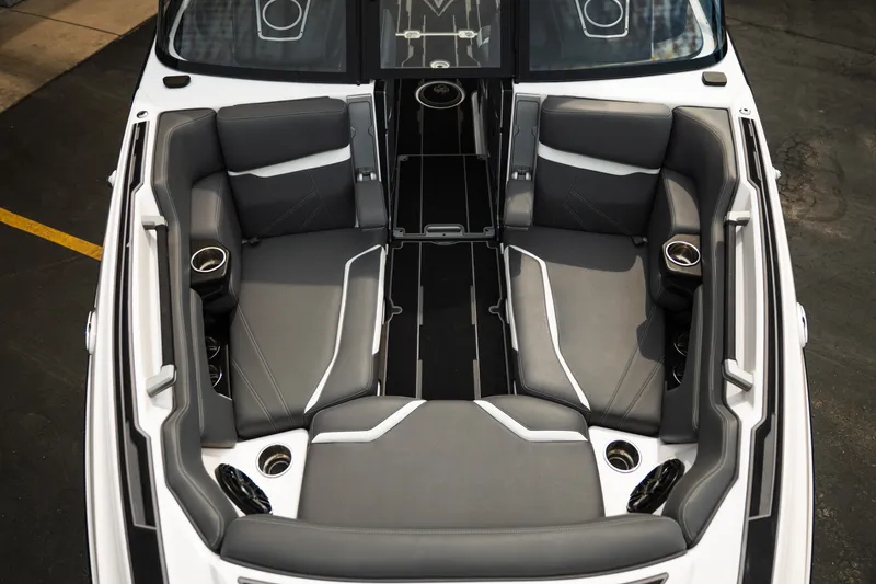 Slide: The Image of 2023 Supra SL 450 boat interior with luxurious gray seating and cup holders. - 15