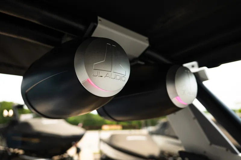 Slide: The Image of JL Audio speakers in a 2023 Supra SL 450, mounted under a canopy. - 29