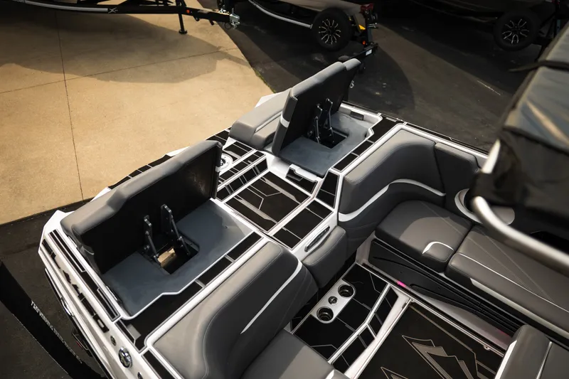 Slide: The Image of 2023 Supra SL 450 boat interior with sleek seating and modern design. - 34