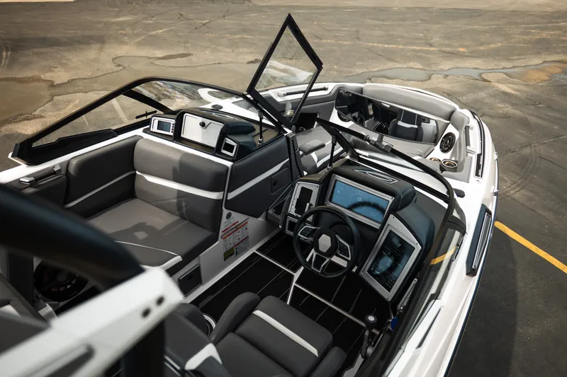Slide: The Image of 2023 Supra SL 450 boat interior with modern dashboard and seating. - 33