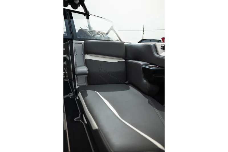 Slide: The Image of 2023 Supra SL 450 boat interior with sleek gray seating and modern design. - 17