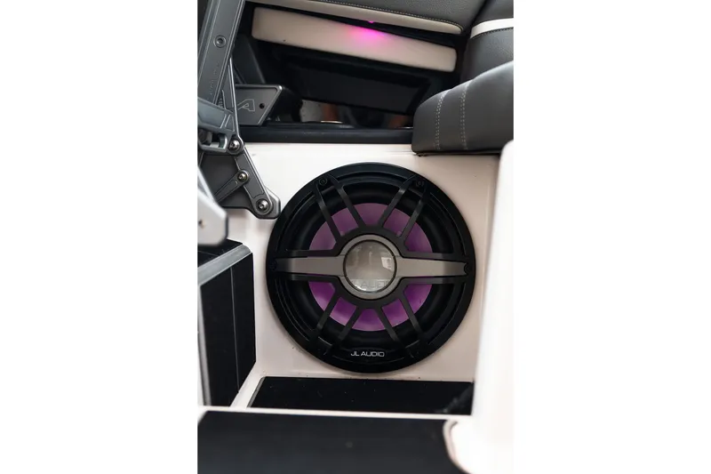 Slide: The Image of 2023 Supra SL 450 interior featuring a JL Audio speaker with purple lighting. - 23