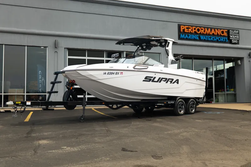 The Image of 2023 Supra SL 450 boat displayed at Performance Marine Watersports dealership. - 1
