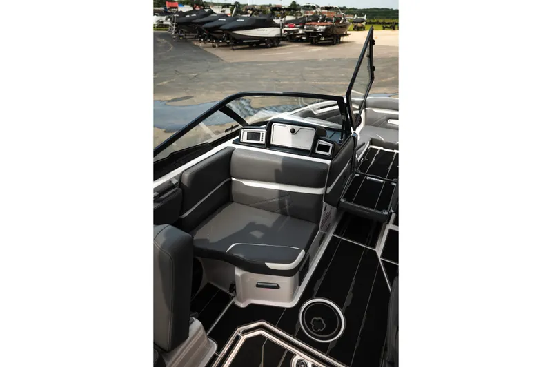 Slide: The Image of 2023 Supra SL 450 boat interior with sleek seating and modern dashboard design. - 27