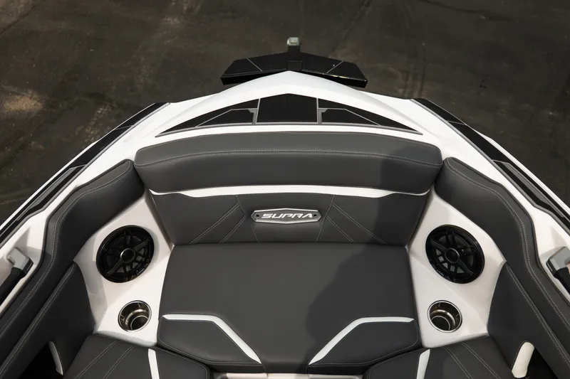 Slide: The Image of Interior of 2023 Supra SL 450 boat with sleek seating and built-in speakers. - 16