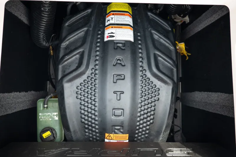 Slide: The Image of 2023 Supra SL 450 engine compartment with Raptor branding and warning labels. - 37