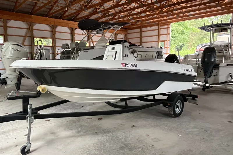 The Image of 2019 Wellcraft 162 Fisherman boat on trailer in storage facility. - 1