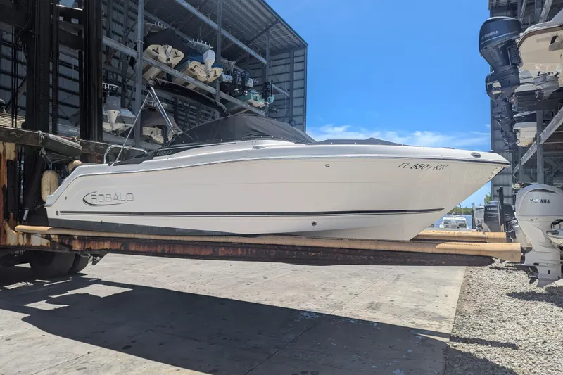 The Image of 2018 Robalo R227 Dual Console boat on forklift in marina storage facility. - 1