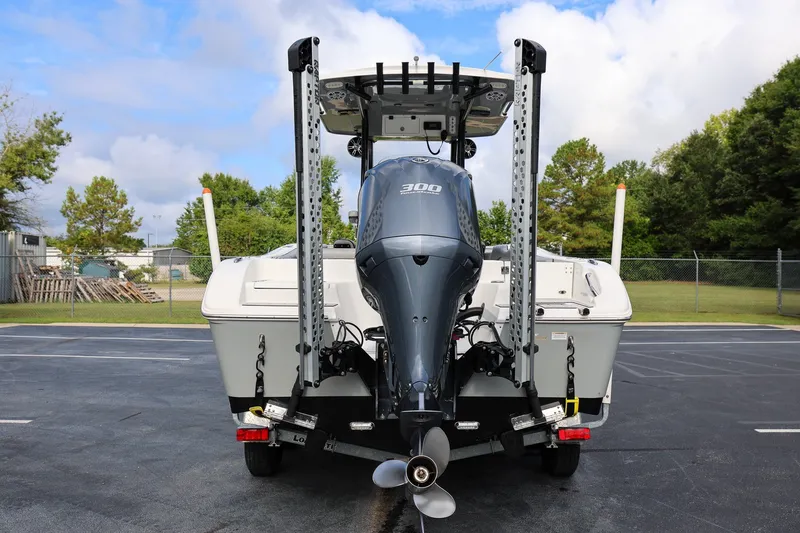 Slide: The Image of 2020 Sea Pro 239 Center Console boat with powerful outboard motor, parked outdoors. - 3