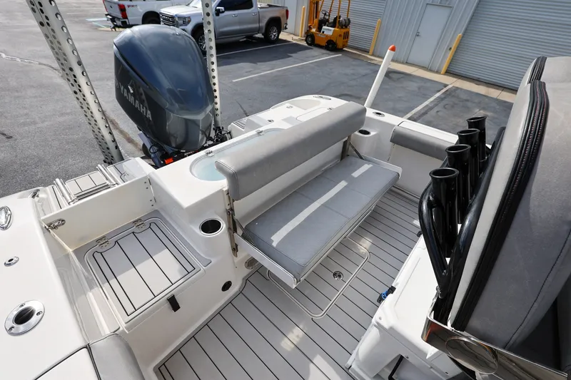 Slide: The Image of 2020 Sea Pro 239 Center Console boat with Yamaha engine, featuring spacious seating and rod holders. - 8