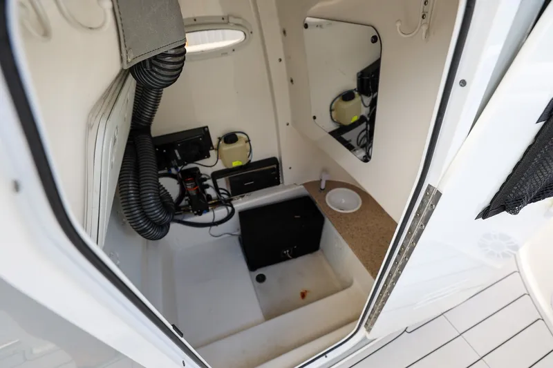 Slide: The Image of Interior view of 2020 Sea Pro 239 Center Console boat's storage compartment. - 14