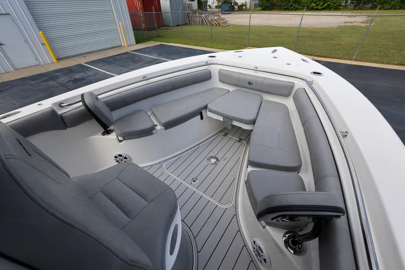 Slide: The Image of 2020 Sea Pro 239 Center Console boat interior with gray seating and spacious layout. - 15