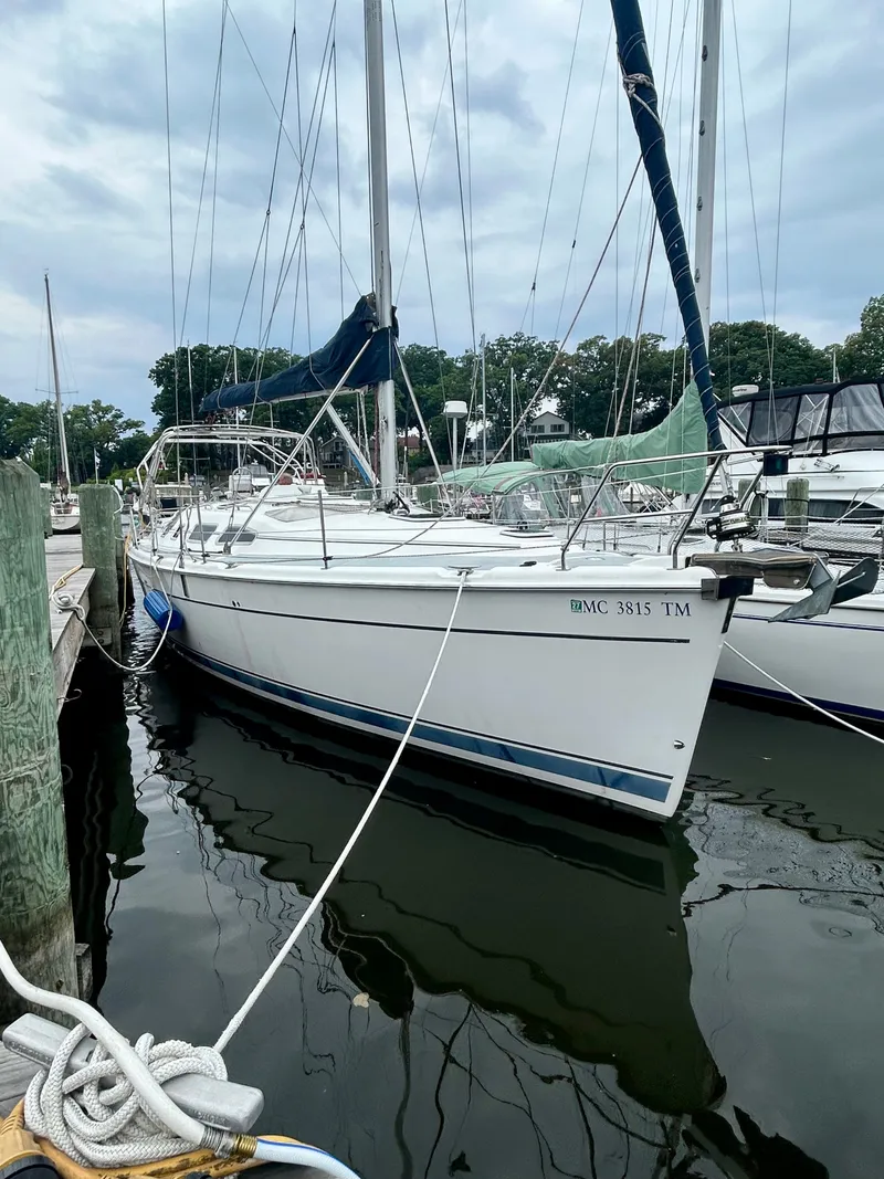 Slide: The Image of 2005 Hunter 41 Aft Cockpit sailboat docked in a marina. - 35