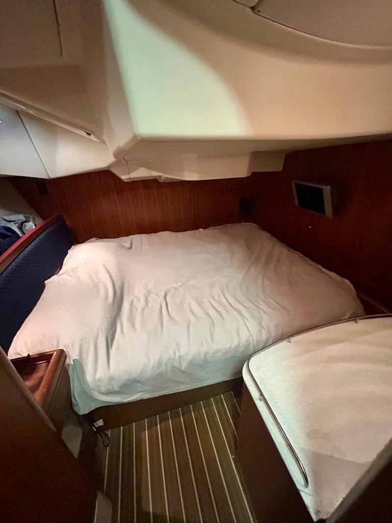 Slide: The Image of The cabin of a 2005 Hunter 41 Aft Cockpit with a cozy double bed. - 10