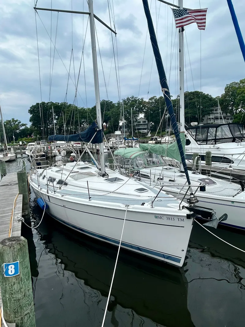 Slide: The Image of 2005 Hunter 41 Aft Cockpit sailboat docked in a marina. - 36