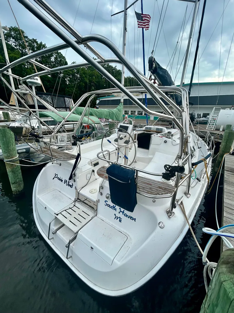 Slide: The Image of Rear view of a 2005 Hunter 41 Aft Cockpit yacht docked in a marina. - 16