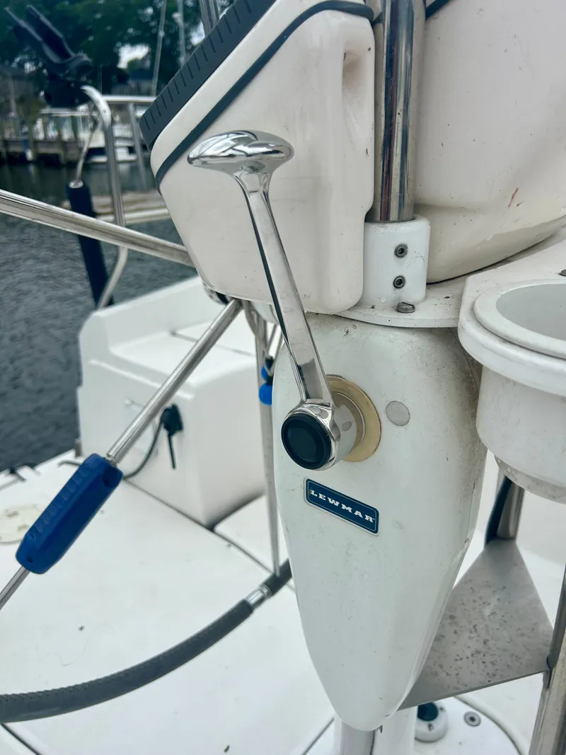 Slide: The Image of Close-up of the helm on a 2005 Hunter 41 Aft Cockpit with Lewmar controls. - 32