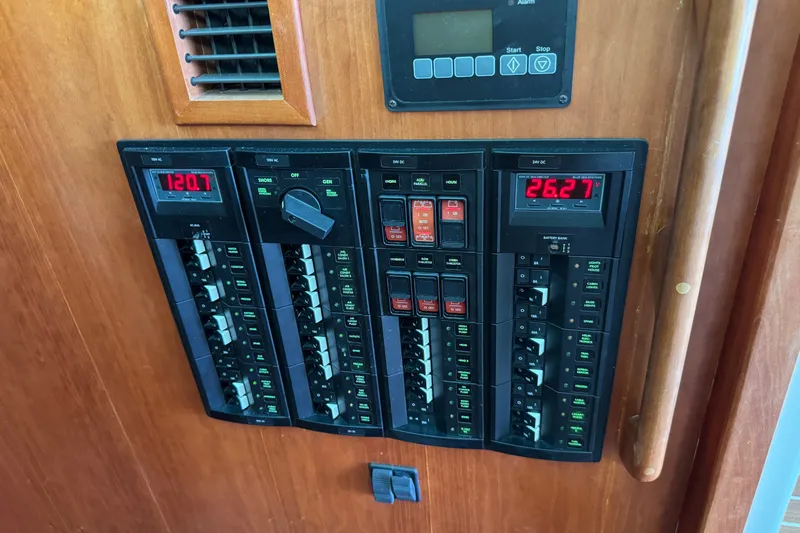 Slide: The Image of Electrical panel on a 2021 Back Cove 41 boat, displaying voltage readings. - 32