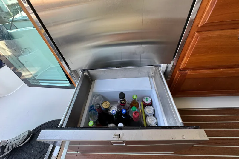 Slide: The Image of Open drawer fridge with assorted beverages on a 2021 Back Cove 41 yacht. - 25