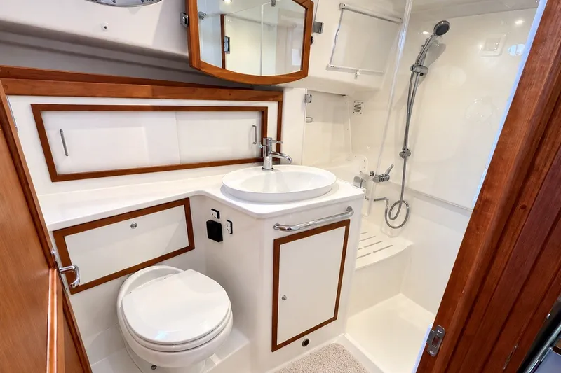 Slide: The Image of Luxurious bathroom in 2021 Back Cove 41 yacht with modern fixtures and wood accents. - 37