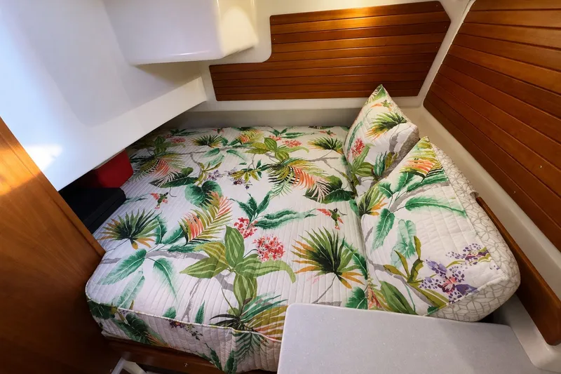 Slide: The Image of Cozy cabin interior of 2021 Back Cove 41 with tropical-themed bedding. - 42