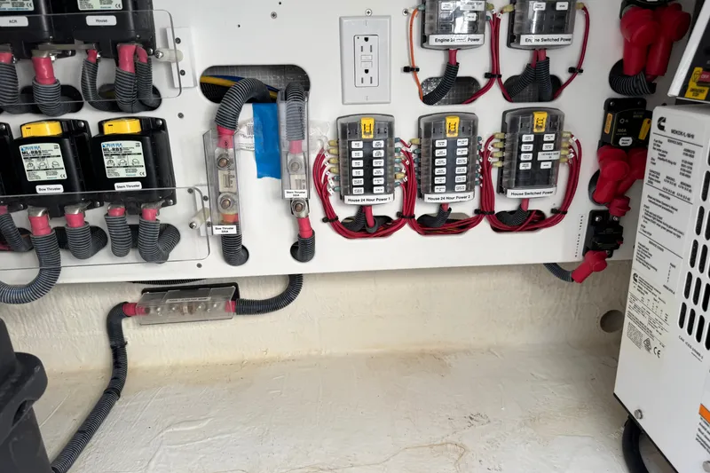 Slide: The Image of Electrical panel of a 2021 Back Cove 41 boat, featuring labeled circuits and wiring. - 14