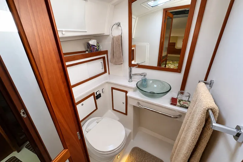 Slide: The Image of Luxurious bathroom in 2021 Back Cove 41 yacht with modern fixtures and wooden accents. - 43