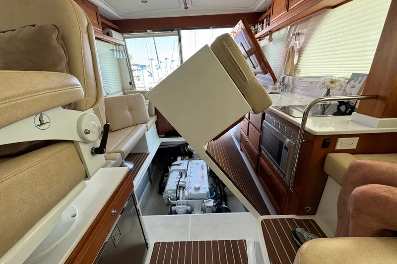 Slide: The Image of Interior of a 2021 Back Cove 41 yacht showing engine access and luxurious seating. - 20