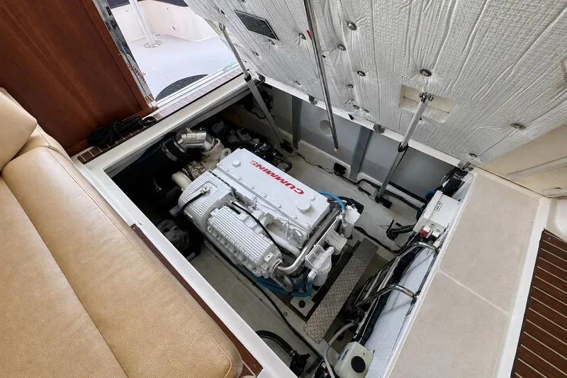 Slide: The Image of Engine compartment of a 2021 Back Cove 41 boat, featuring a Cummins engine. - 21