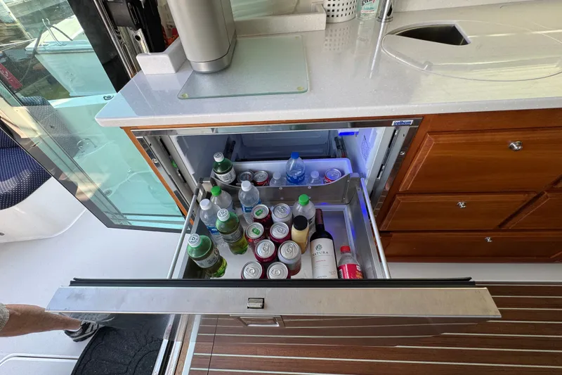 Slide: The Image of Open drawer fridge on 2021 Back Cove 41 yacht, stocked with beverages. - 24